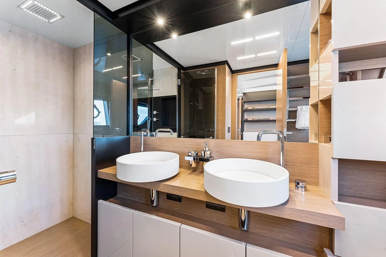 a bathroom with sinks and mirrors aboard SUNSATION Yacht for Sale