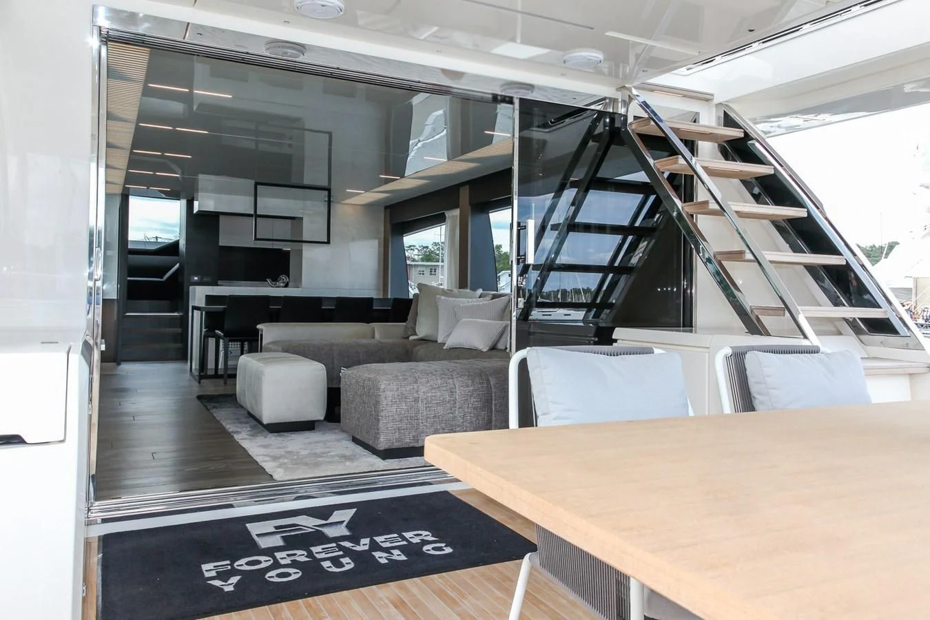 a room with a couch and a table aboard SUNSATION Yacht for Sale