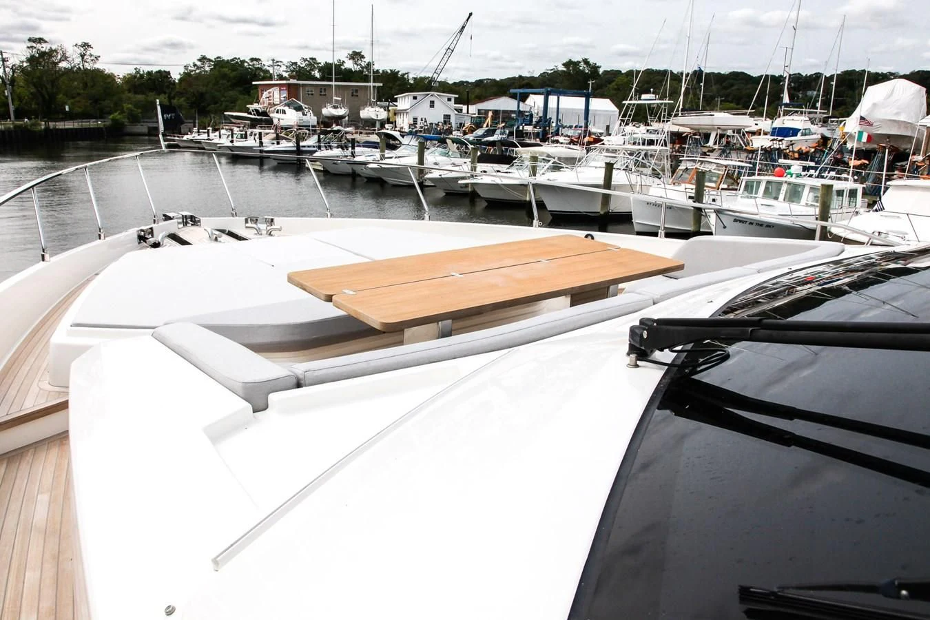 a boat dock with many boats aboard SUNSATION Yacht for Sale