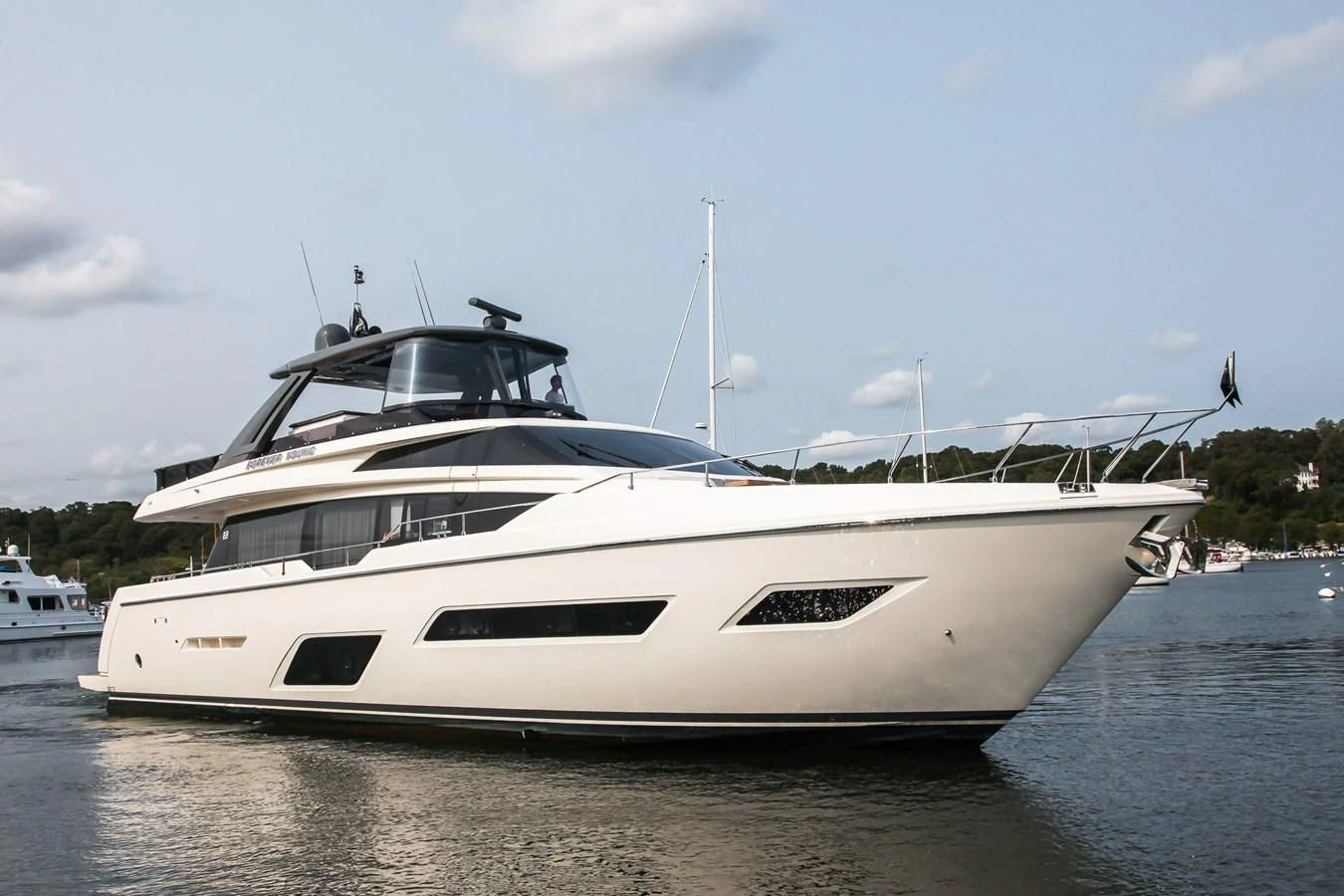 a white yacht in the water aboard SUNSATION Yacht for Sale