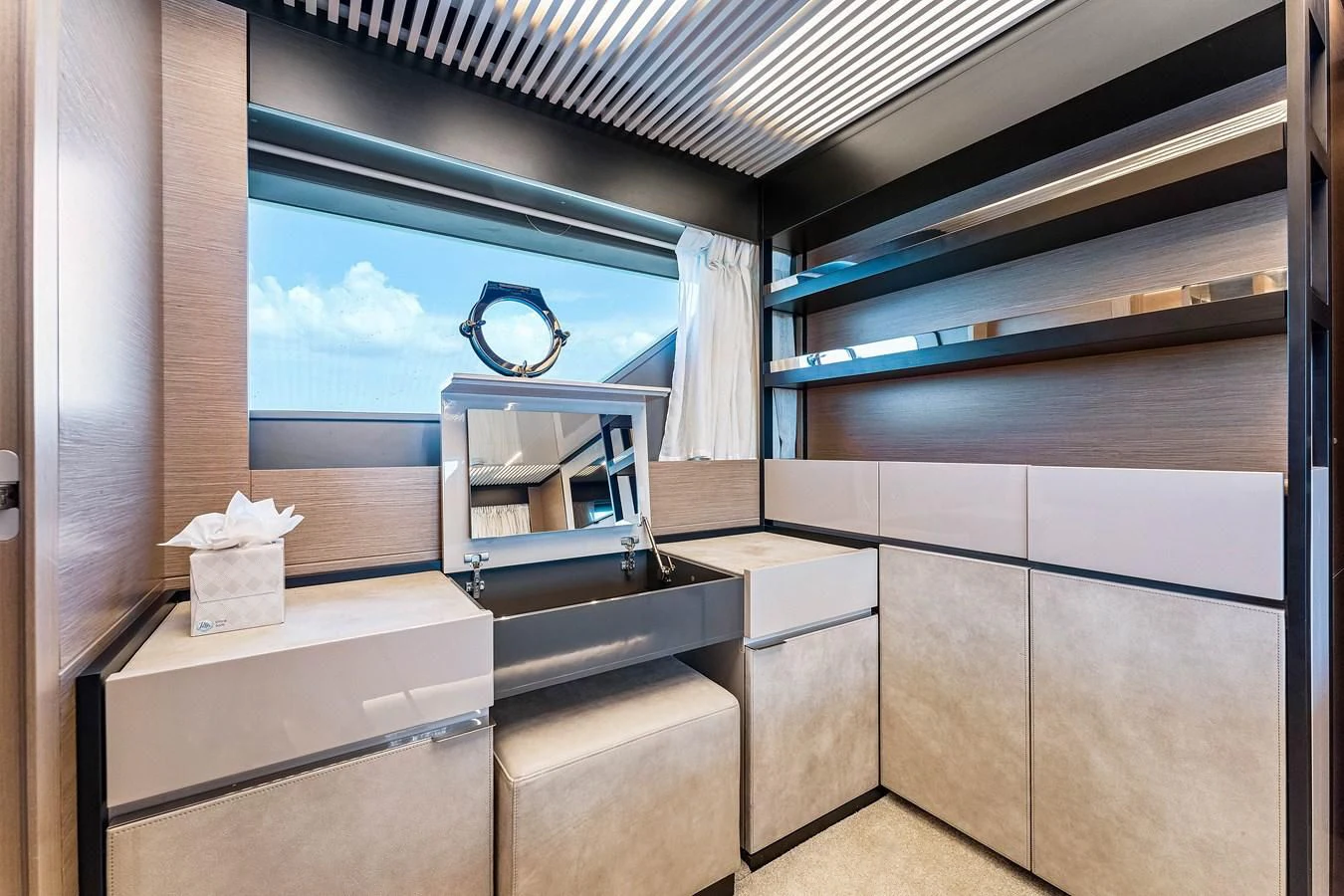 a room with a desk and a window aboard SUNSATION Yacht for Sale