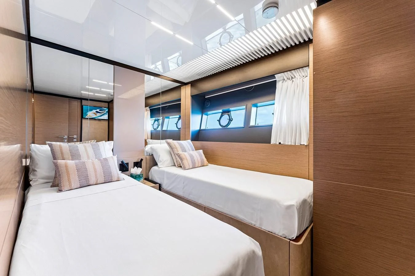 a room with two beds aboard SUNSATION Yacht for Sale
