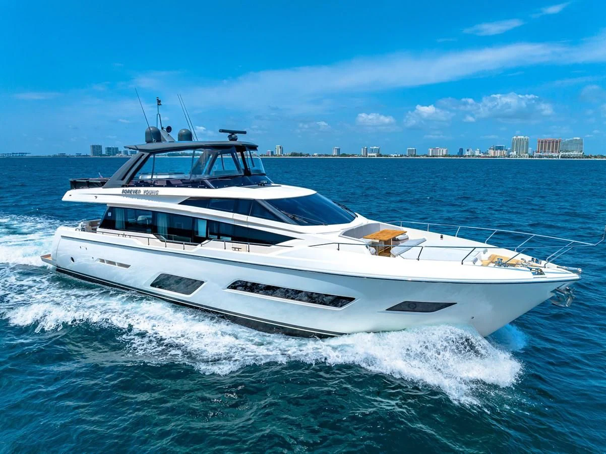 a white yacht on the water aboard SUNSATION Yacht for Sale