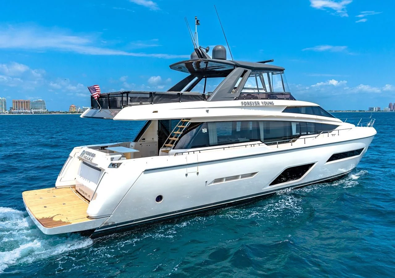 a white yacht on the water aboard SUNSATION Yacht for Sale