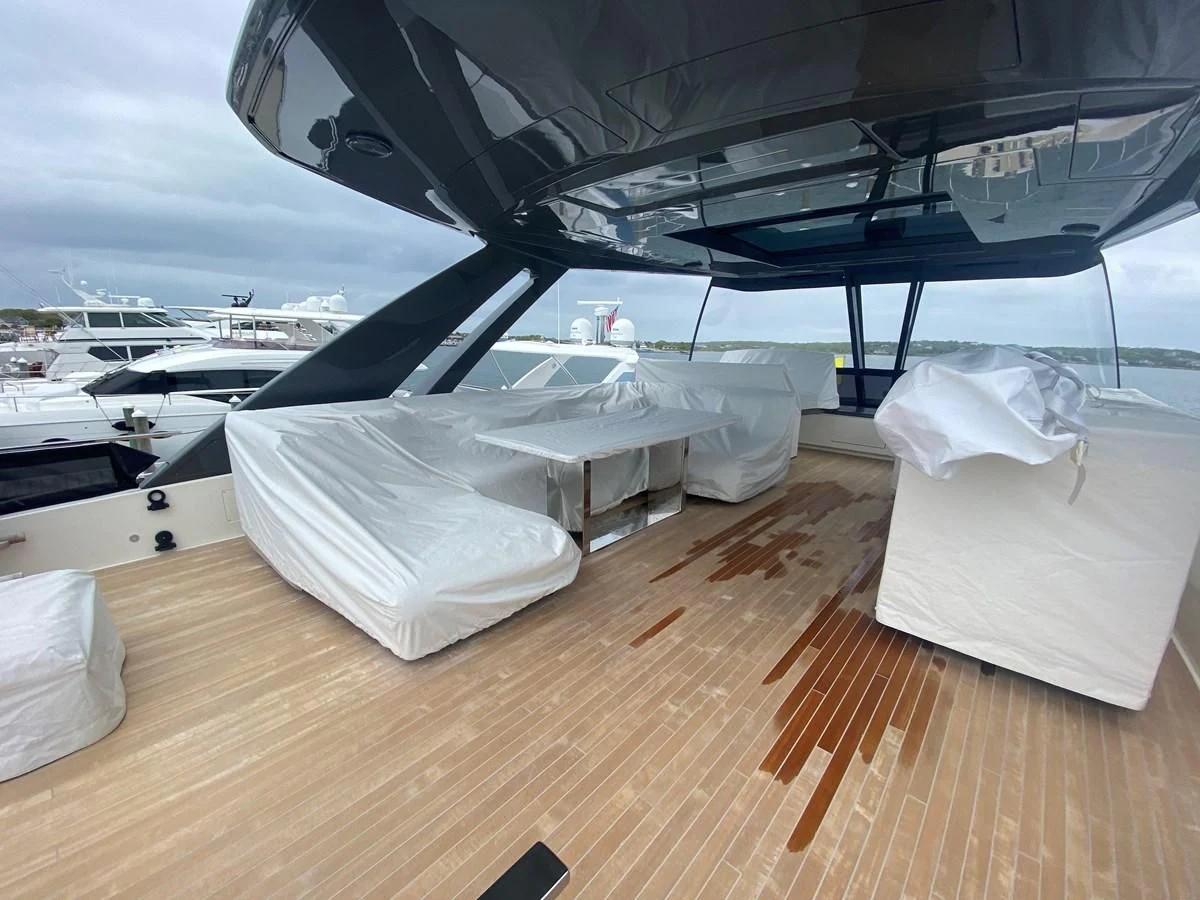 a deck with a large boat on it aboard SUNSATION Yacht for Sale