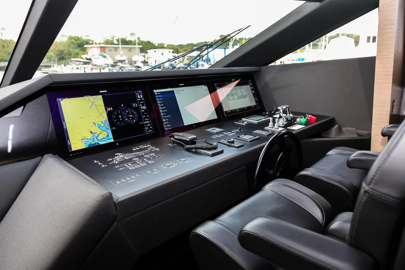 a car with a laptop and monitors aboard SUNSATION Yacht for Sale