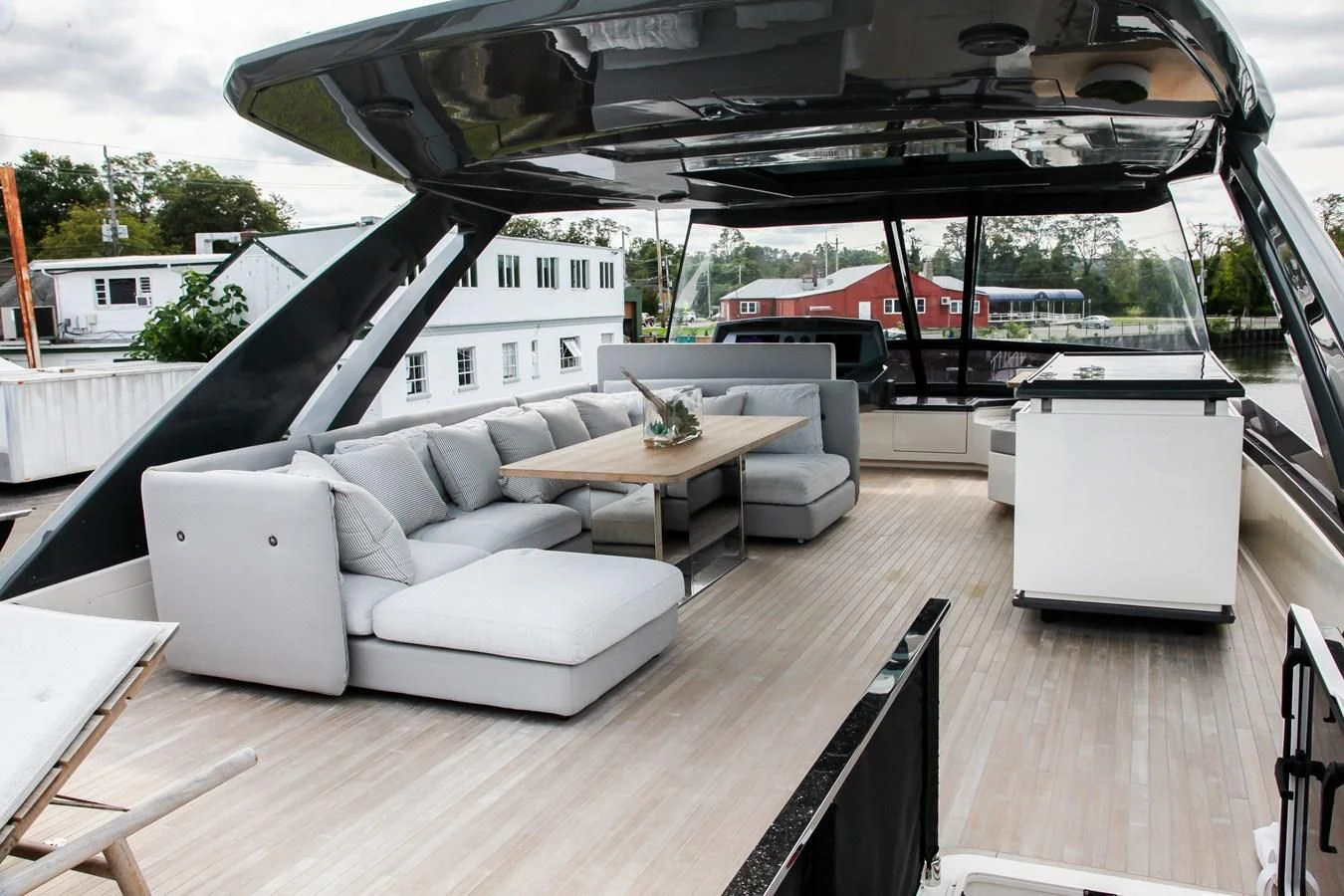a patio with a table and chairs aboard SUNSATION Yacht for Sale