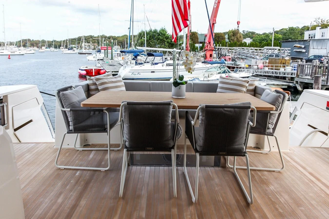 a table and chairs on a deck aboard SUNSATION Yacht for Sale