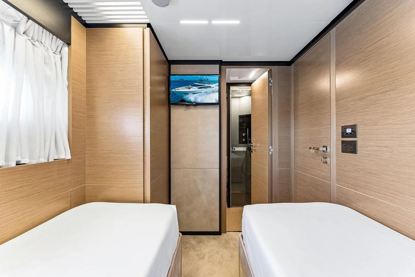 a bathroom with a bathtub and a shower aboard SUNSATION Yacht for Sale