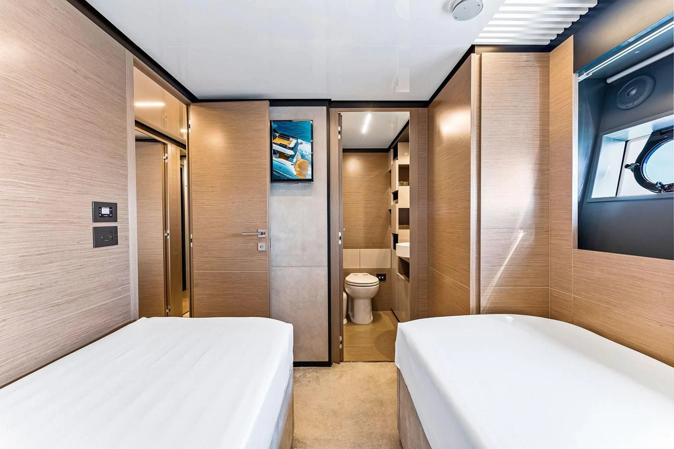 a bathroom with a tub toilet and sink aboard SUNSATION Yacht for Sale
