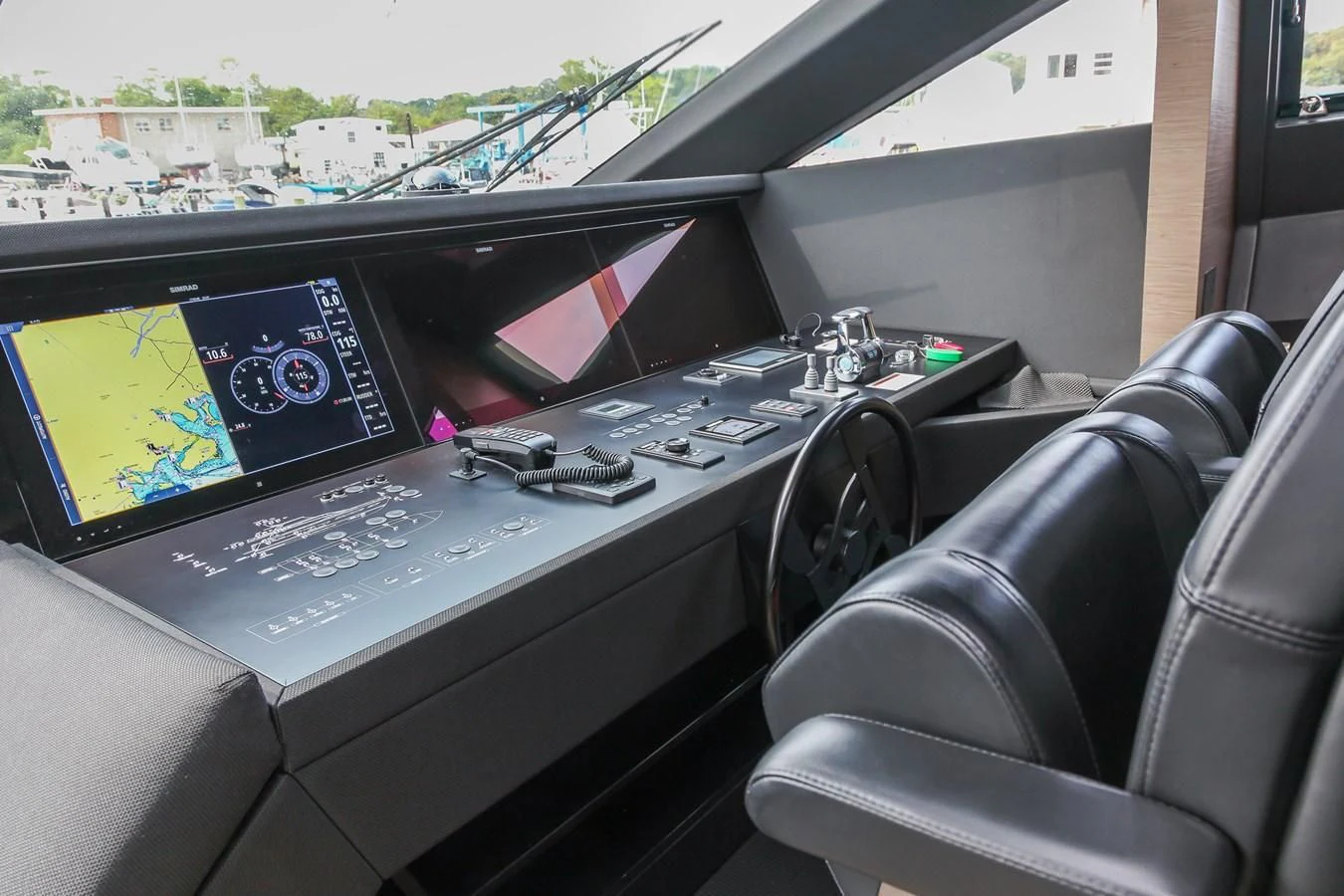 a black electronic device with a screen and buttons on a car aboard SUNSATION Yacht for Sale