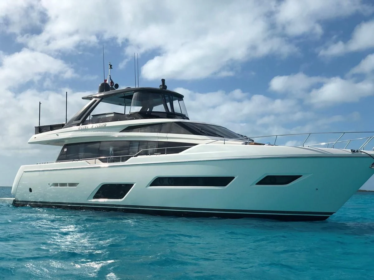 a white yacht in the water aboard SUNSATION Yacht for Sale