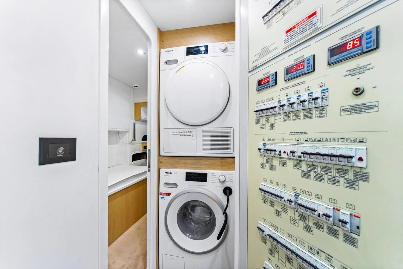 a washing machine in a room aboard SUNSATION Yacht for Sale
