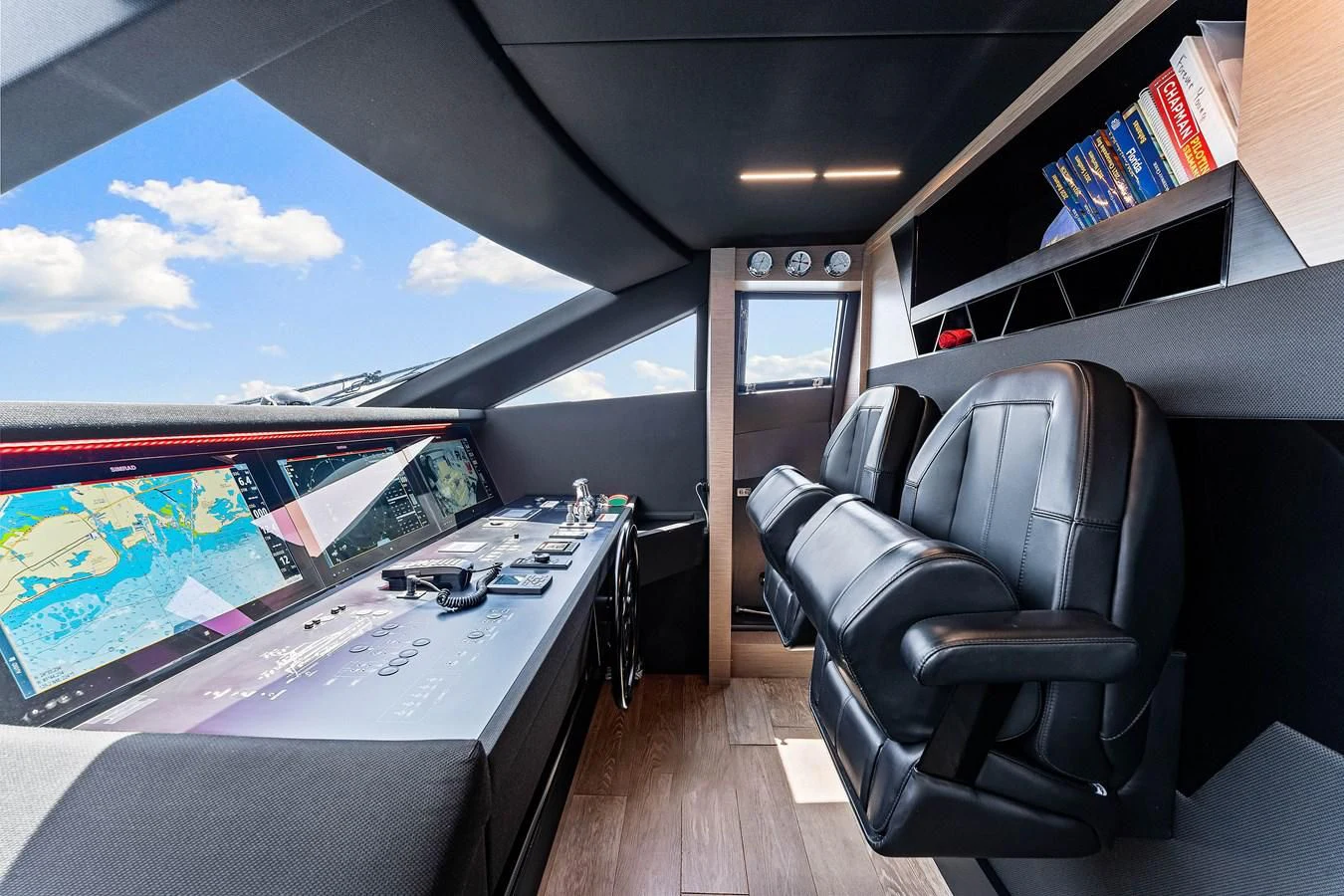 a room with a desk and chairs aboard SUNSATION Yacht for Sale