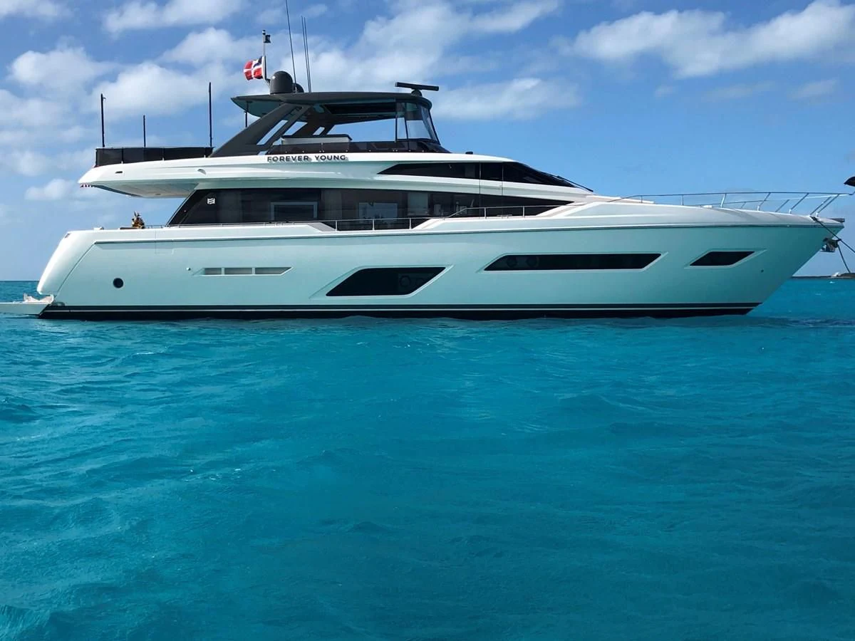 a white yacht in the water aboard SUNSATION Yacht for Sale