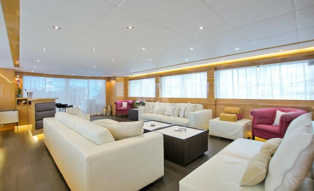 a living room with white couches aboard VILLA SUL MARE Yacht for Sale