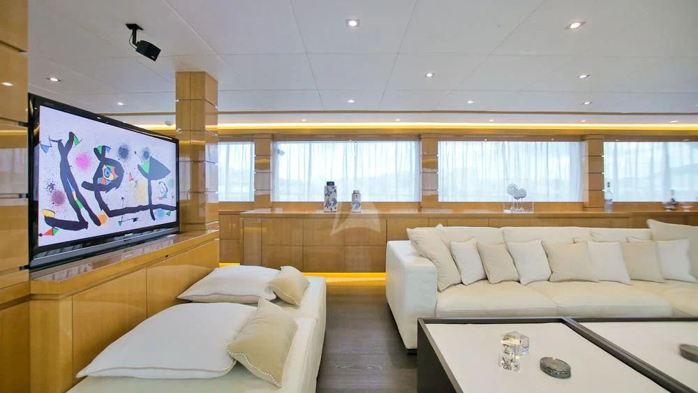 a room with a couch and a table aboard VILLA SUL MARE Yacht for Sale