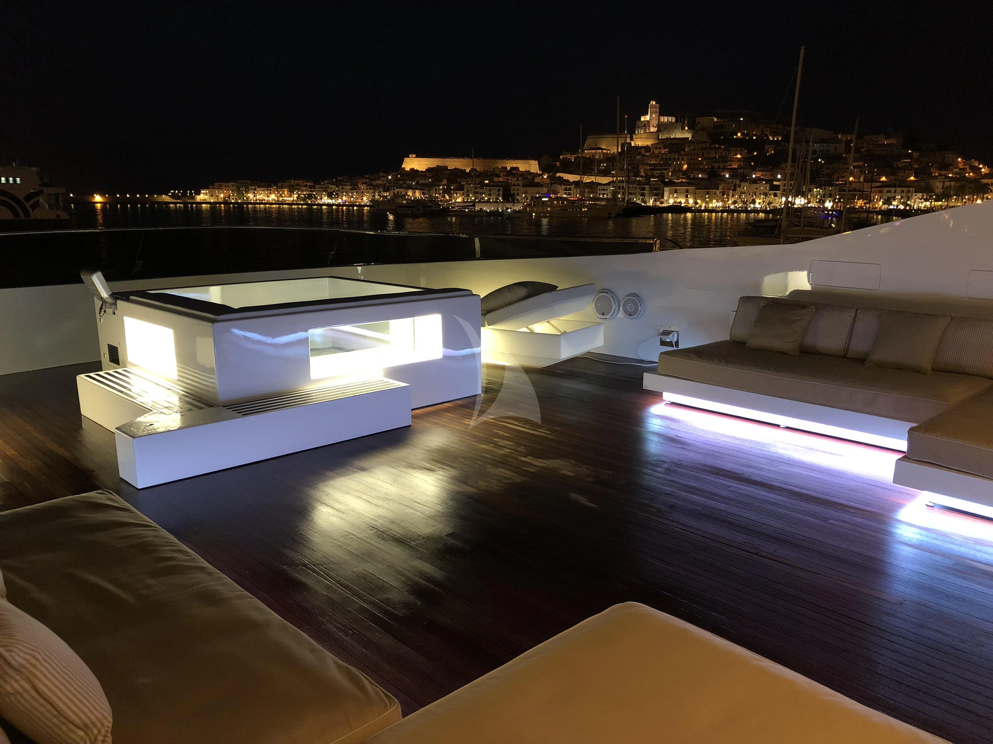 a pool at night aboard VILLA SUL MARE Yacht for Sale
