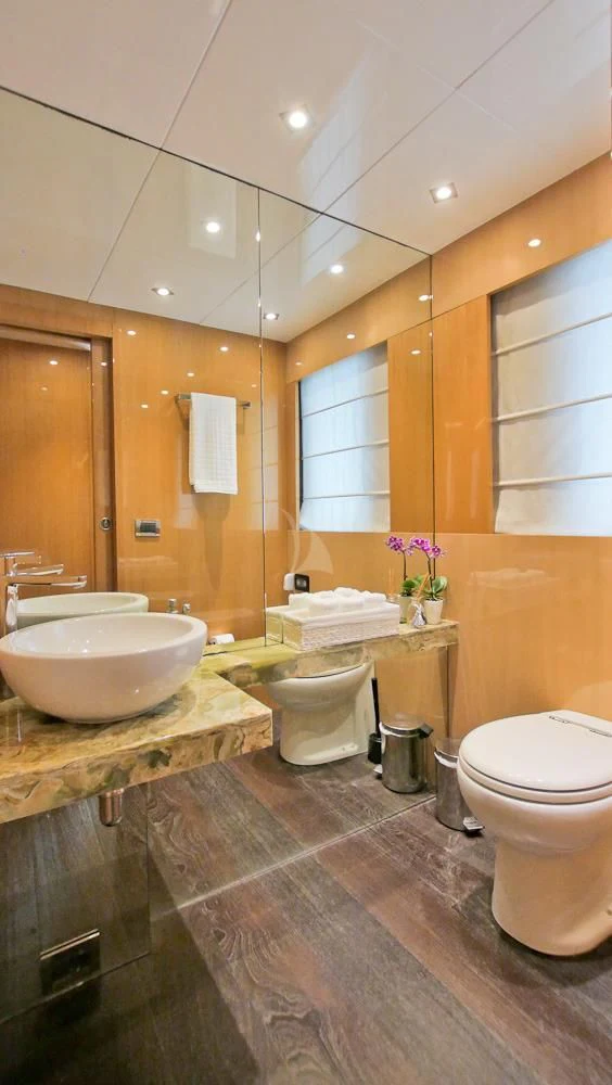 a bathroom with a large mirror aboard VILLA SUL MARE Yacht for Sale