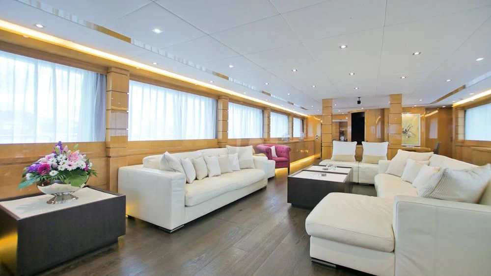 a living room with white couches aboard VILLA SUL MARE Yacht for Sale