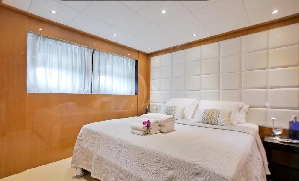 a room with a bed and a window aboard VILLA SUL MARE Yacht for Sale