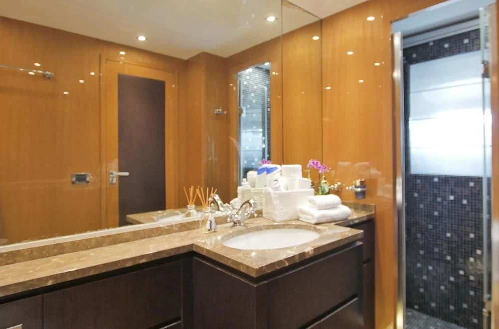 a bathroom with a countertop sink and a mirror aboard VILLA SUL MARE Yacht for Sale