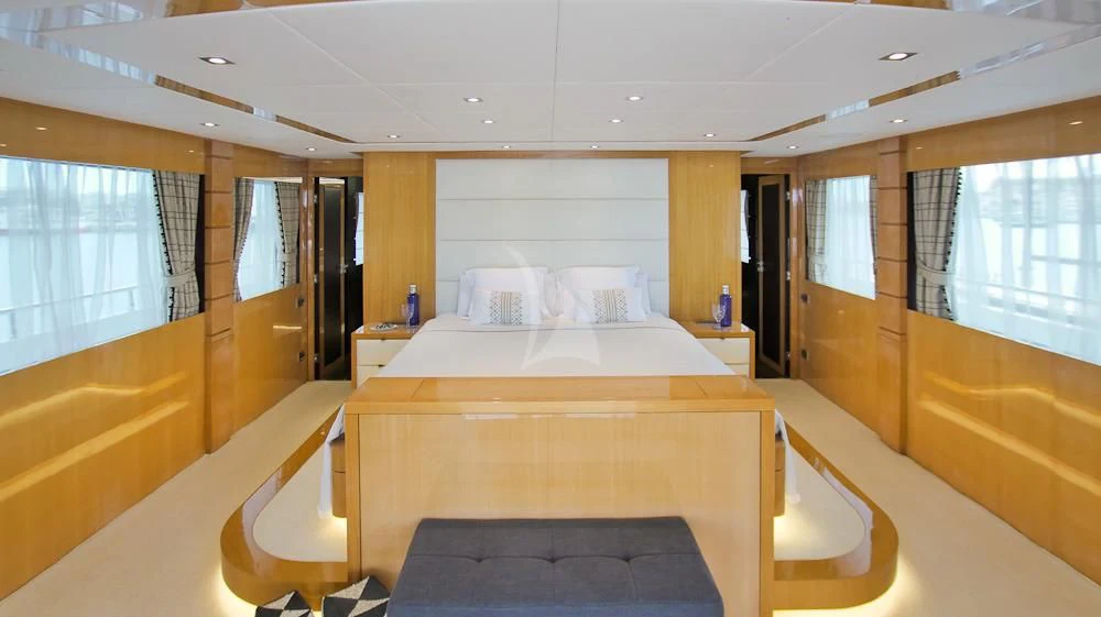 a room with a bed and a window aboard VILLA SUL MARE Yacht for Sale