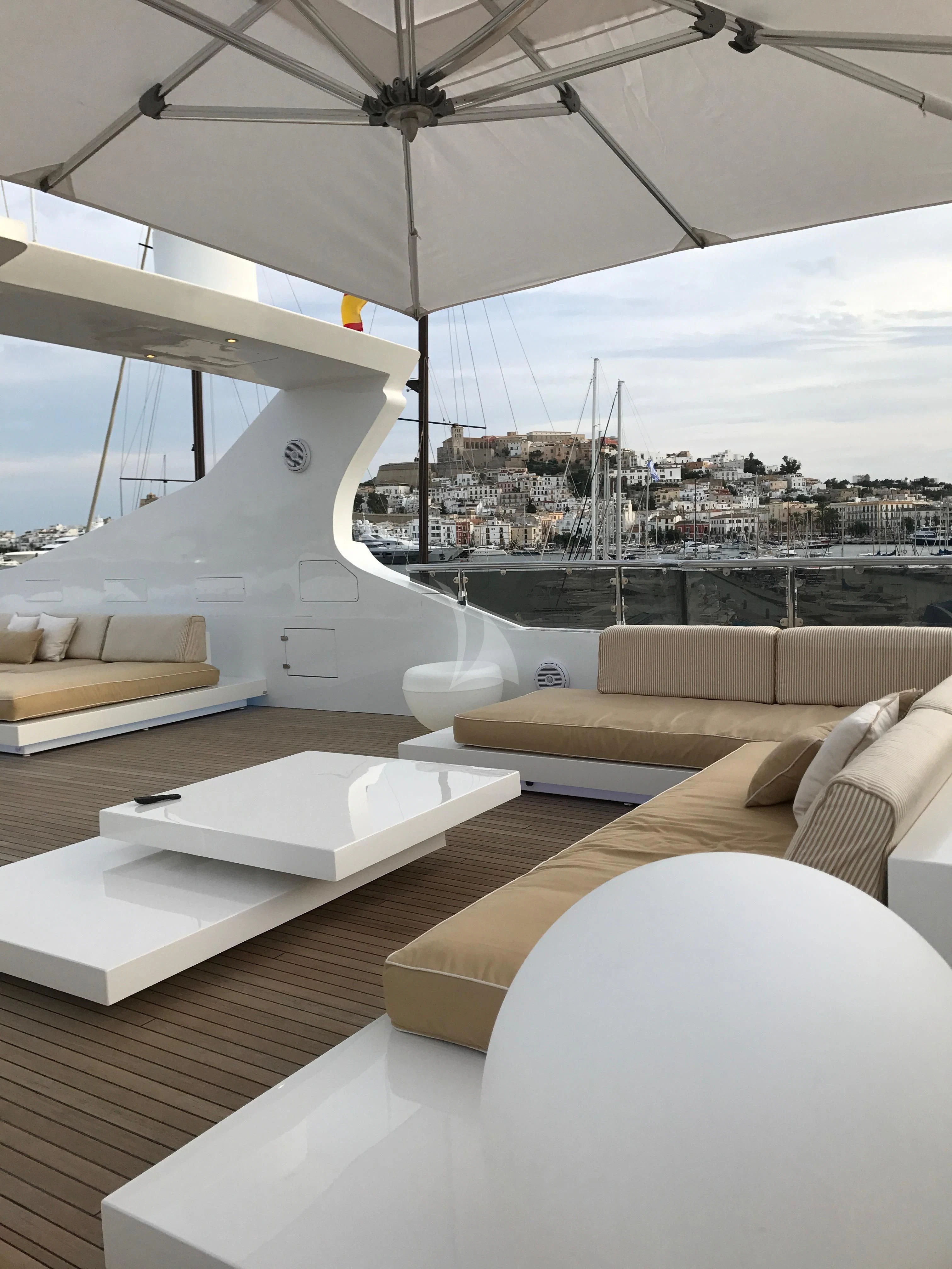 a room with a view of a city and a large body of water aboard VILLA SUL MARE Yacht for Sale