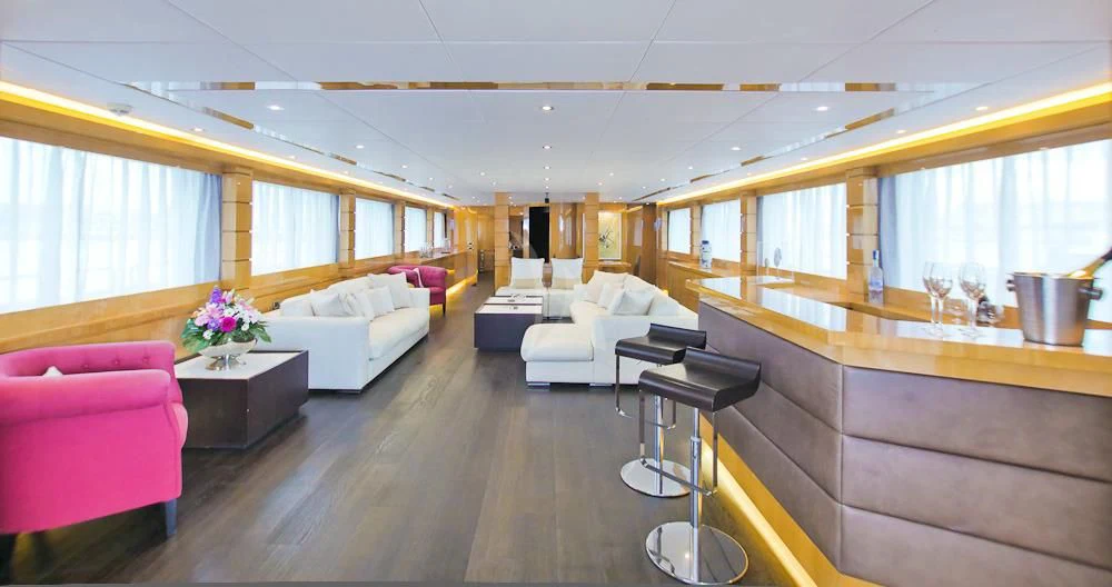 a large living room with a large window aboard VILLA SUL MARE Yacht for Sale