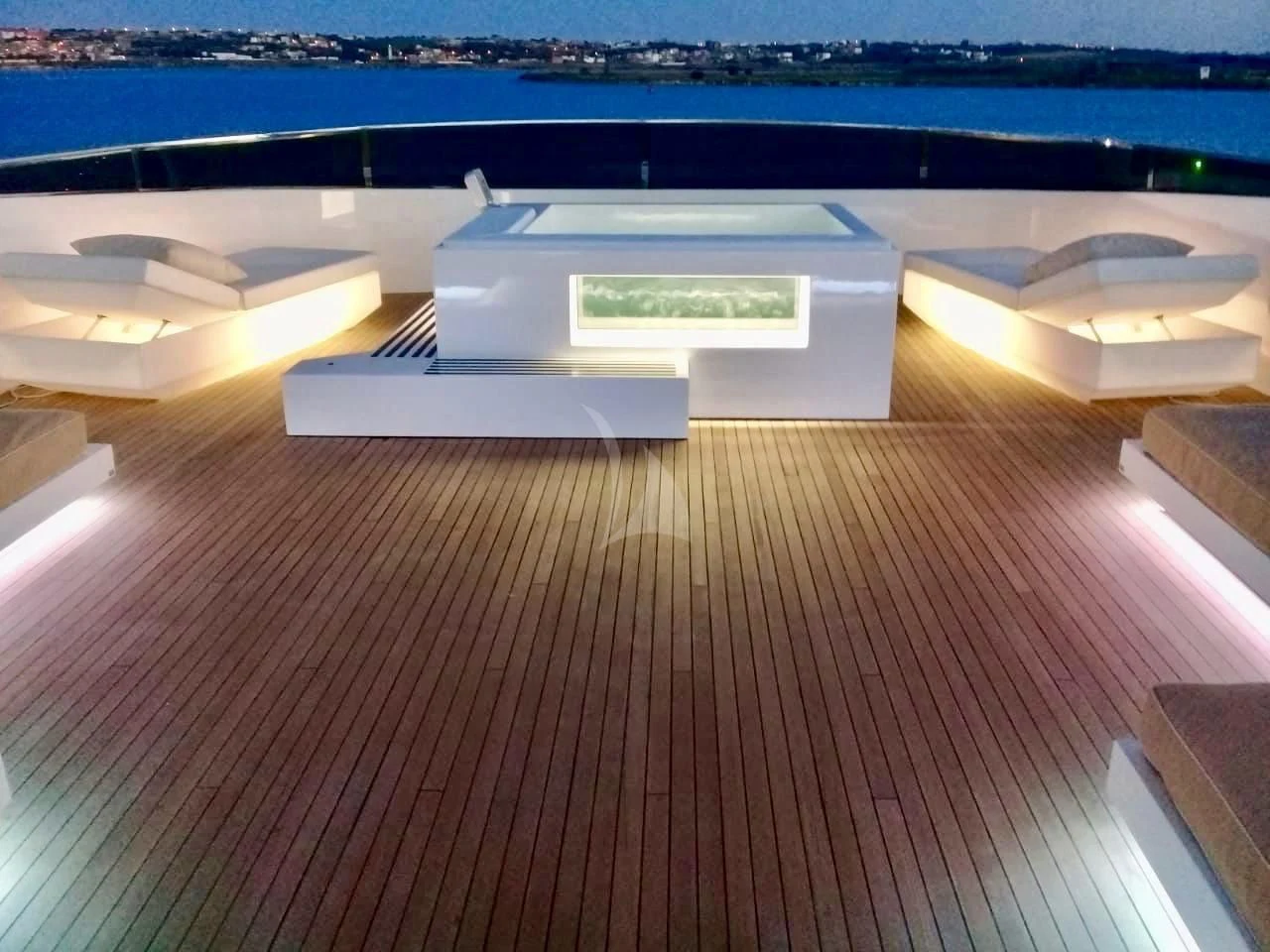 a room with a table and a large white box on a wooden floor aboard VILLA SUL MARE Yacht for Sale