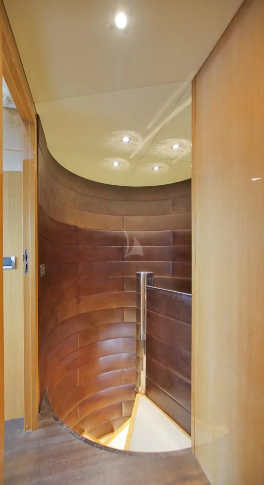a wooden bathroom with a wood door aboard VILLA SUL MARE Yacht for Sale