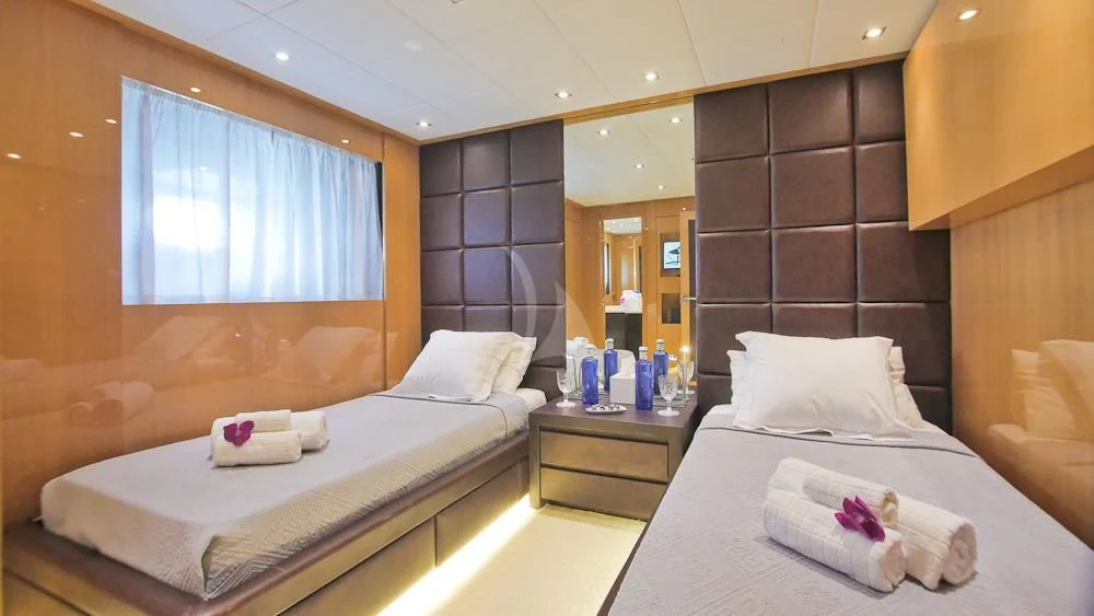 a couple of beds in a hotel room aboard VILLA SUL MARE Yacht for Sale