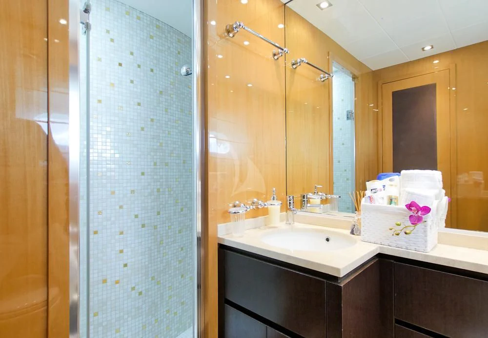 a bathroom with a shower unit and sink aboard VILLA SUL MARE Yacht for Sale