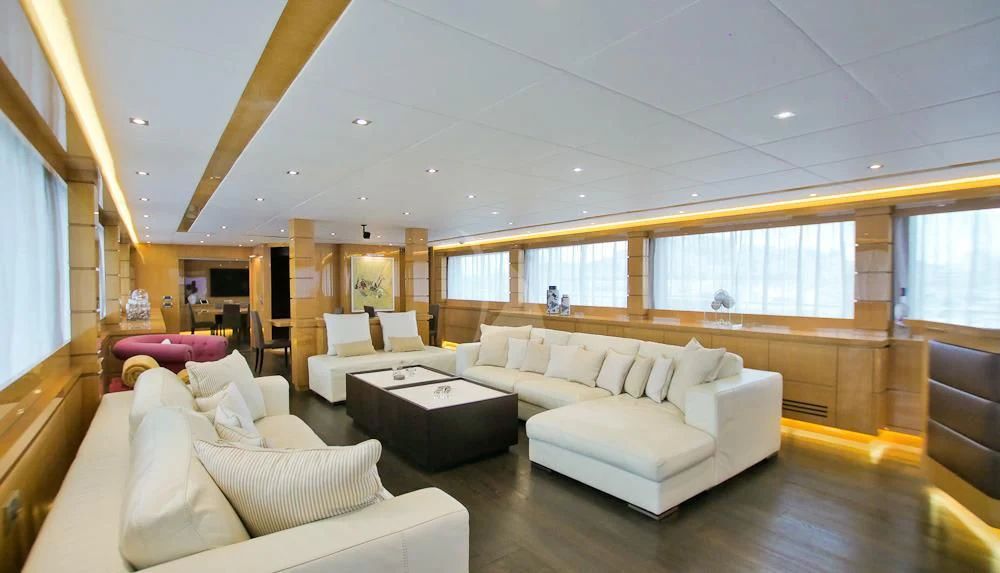 a living room with white couches aboard VILLA SUL MARE Yacht for Sale