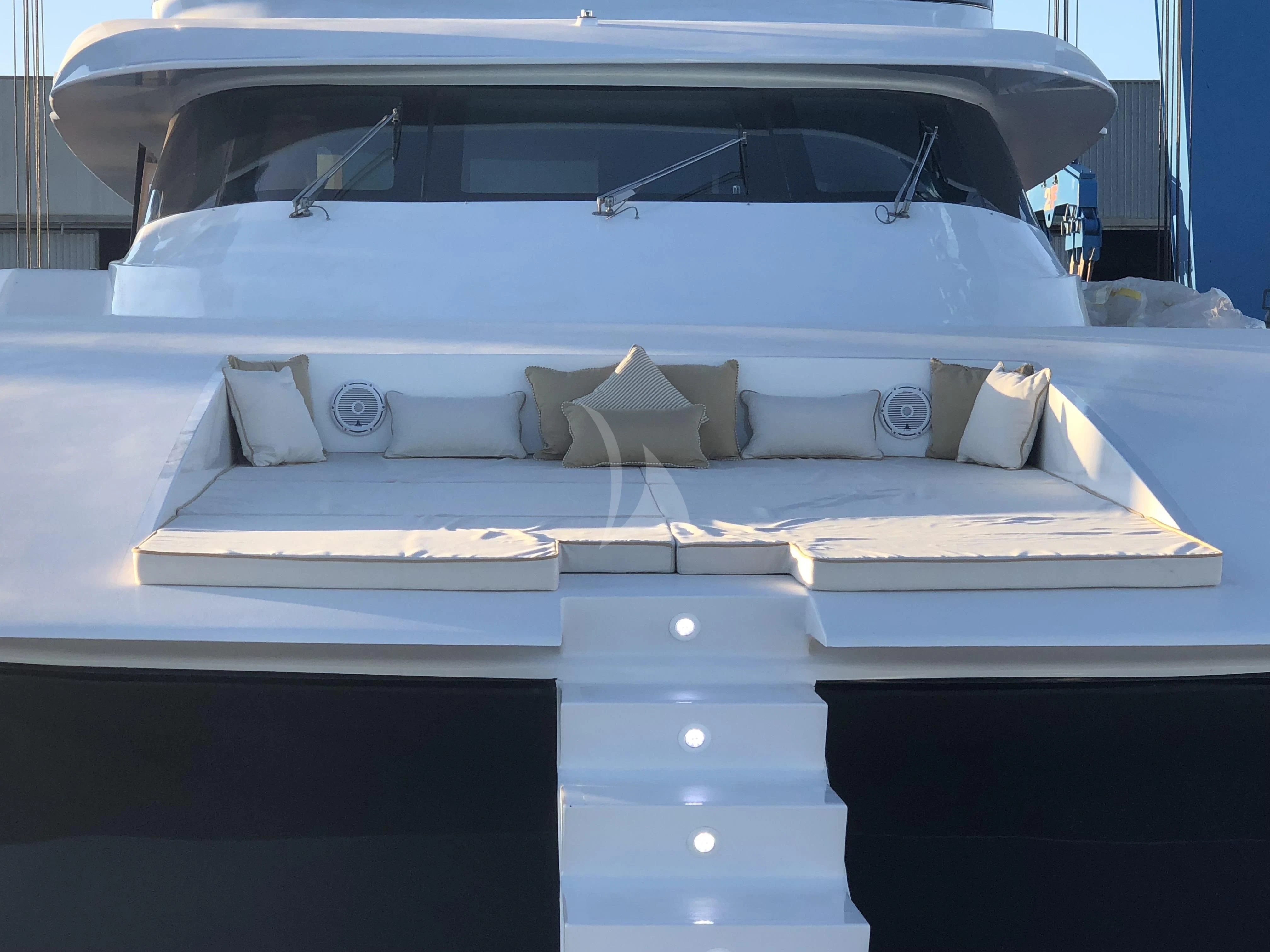 a white car with a stack of books on it aboard VILLA SUL MARE Yacht for Sale