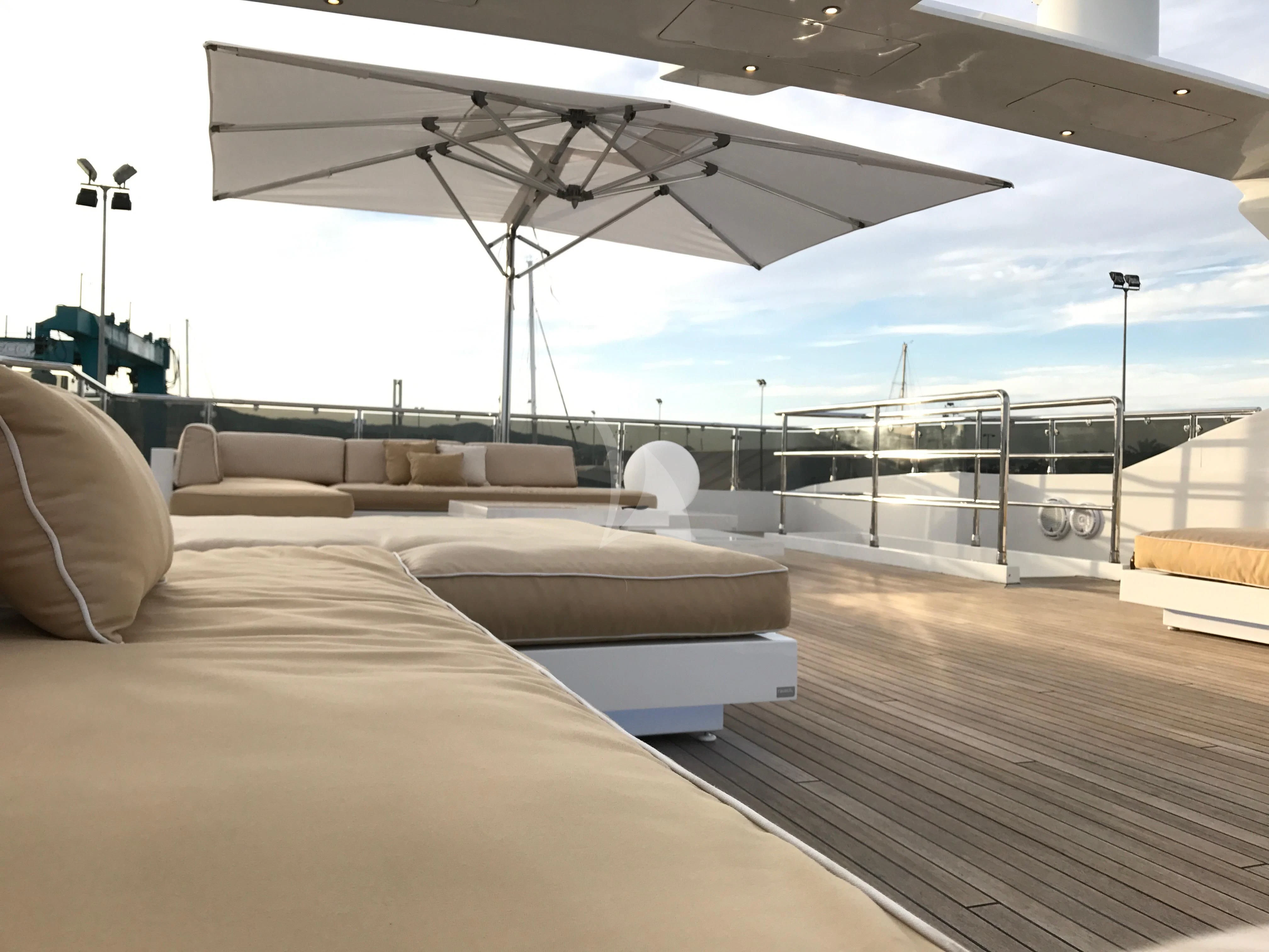 a large white lounge chair on a deck with a large white tent aboard VILLA SUL MARE Yacht for Sale