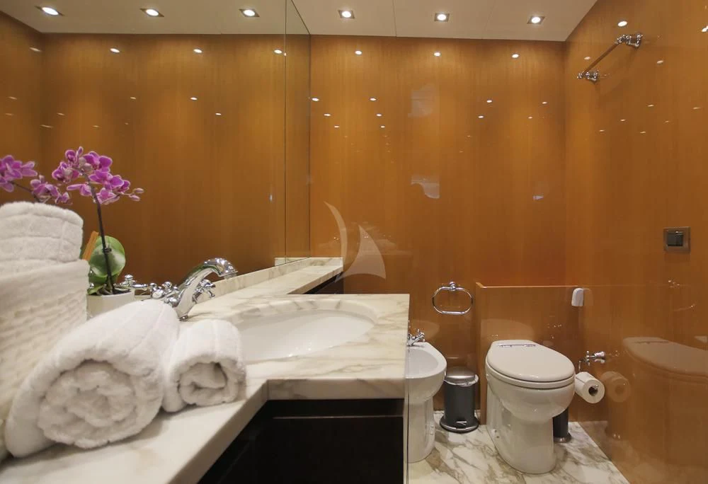 a bathroom with a bathtub and toilet aboard VILLA SUL MARE Yacht for Sale