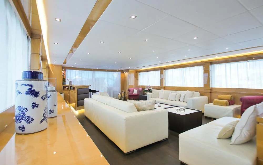 a living room with white couches aboard VILLA SUL MARE Yacht for Sale
