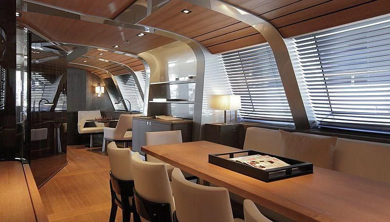 a room with tables and chairs aboard SEAHAWK Yacht for Sale