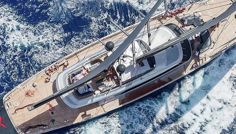 a space shuttle flying over a snowy mountain aboard SEAHAWK Yacht for Sale