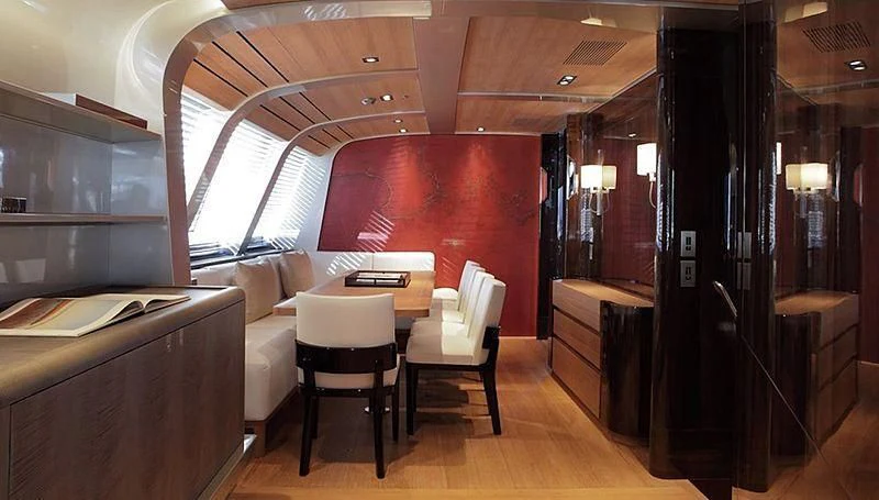 a room with a table and chairs aboard SEAHAWK Yacht for Sale