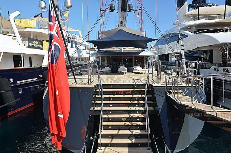 a boat with a red and white flag on it aboard SEAHAWK Yacht for Sale
