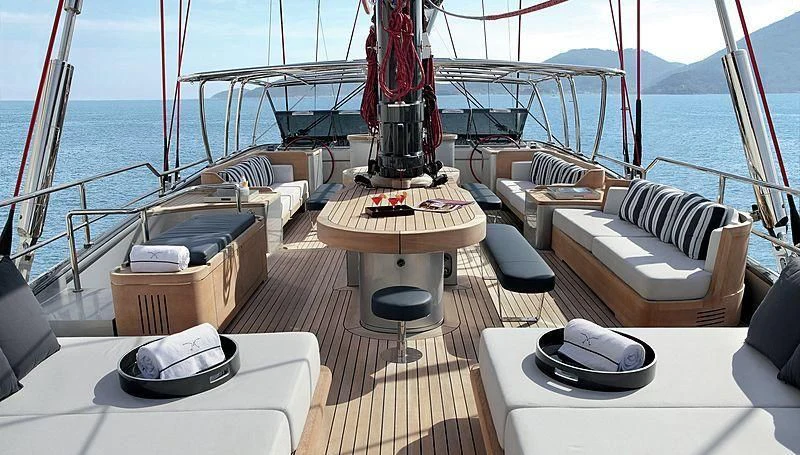 a deck with a large deck and a large boat in the background aboard SEAHAWK Yacht for Sale