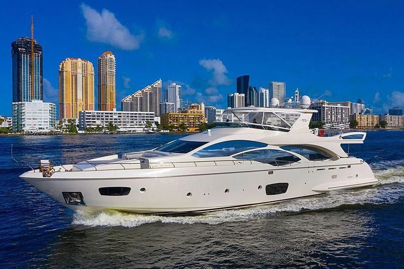 a white yacht on the water aboard BT2 Yacht for Sale