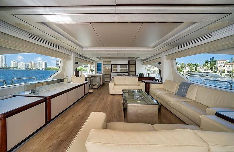 a living room with a large window aboard BT2 Yacht for Sale