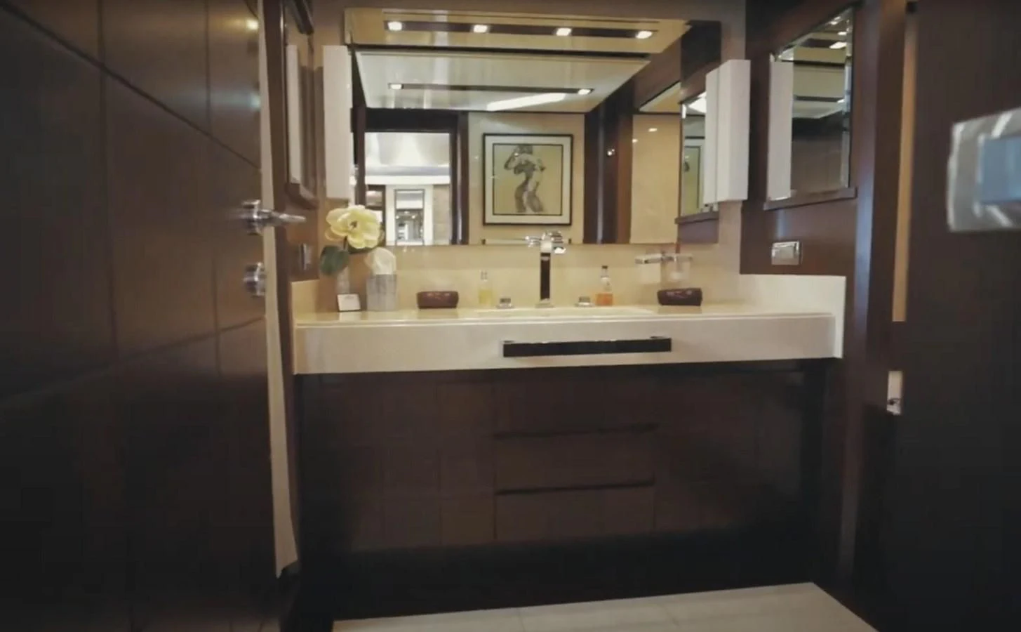 a bathroom with a sink and mirror aboard BT2 Yacht for Sale