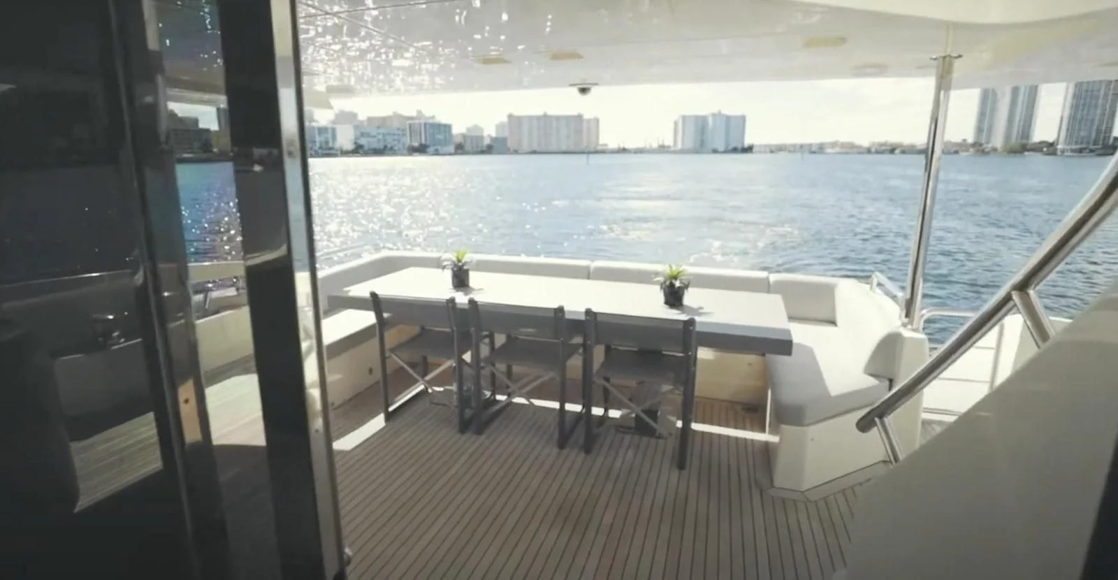 a room with a table and chairs aboard BT2 Yacht for Sale