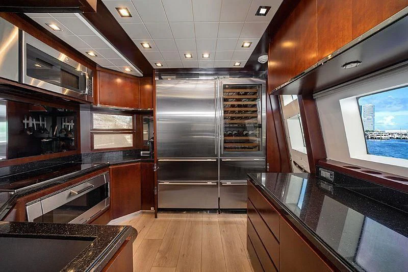 a kitchen with a large stainless steel oven and a large island aboard BT2 Yacht for Sale