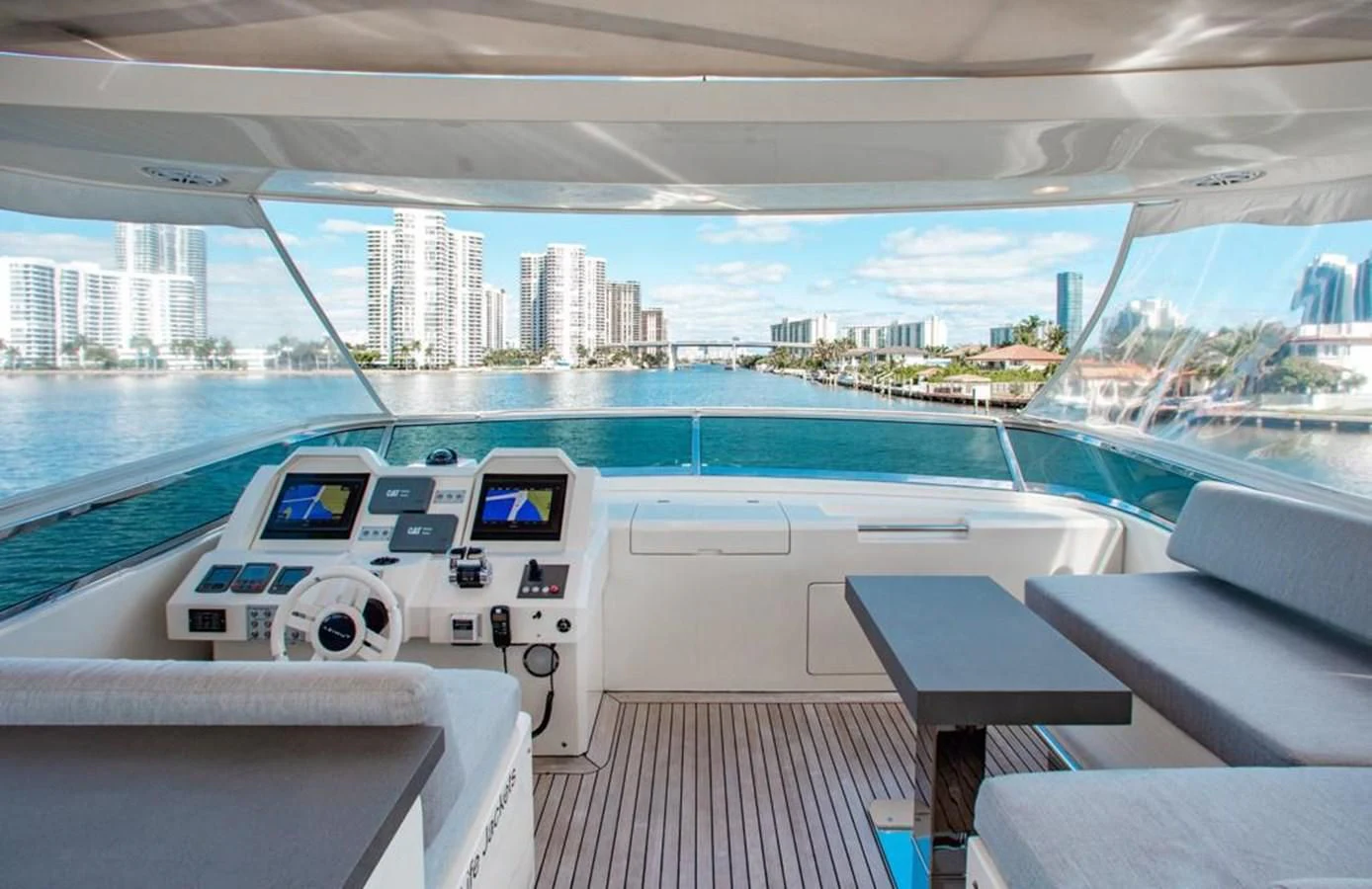 a deck with a view of a city and a body of water aboard BT2 Yacht for Sale