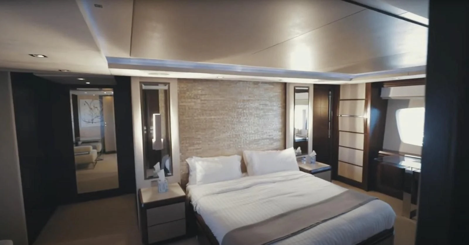 a room with a bed and a mirror aboard BT2 Yacht for Sale